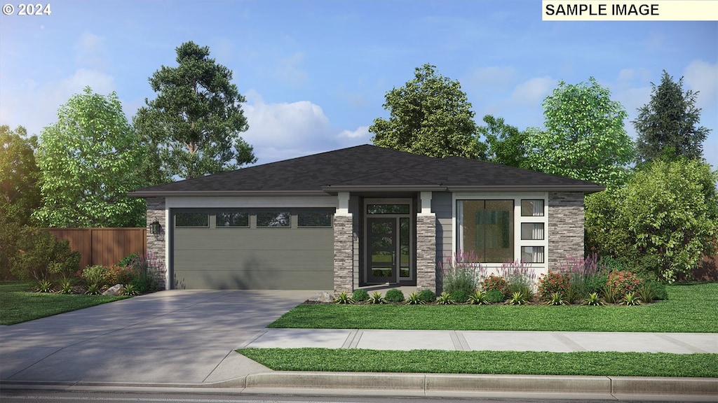 prairie-style home with a garage and a front lawn