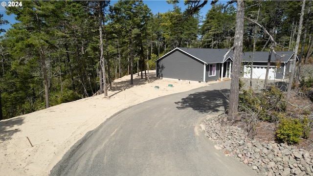 view of front of property with a garage