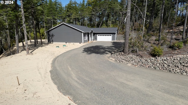 exterior space featuring crawl space, driveway, and an attached garage