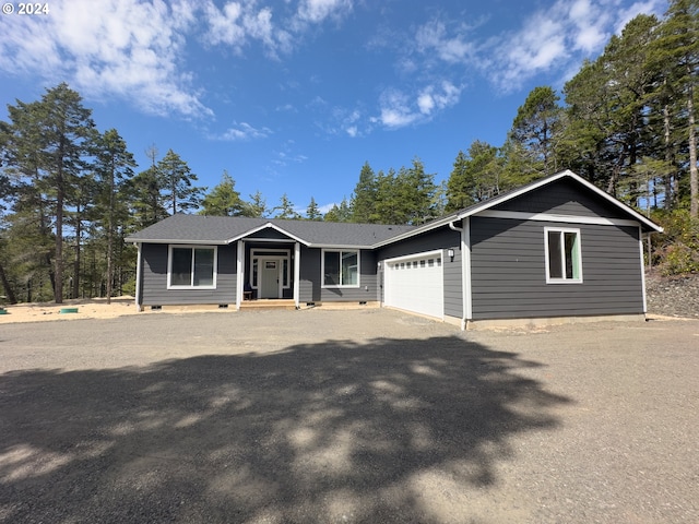 ranch-style house featuring a garage and crawl space