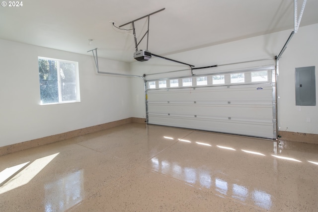 garage with electric panel, baseboards, and a garage door opener