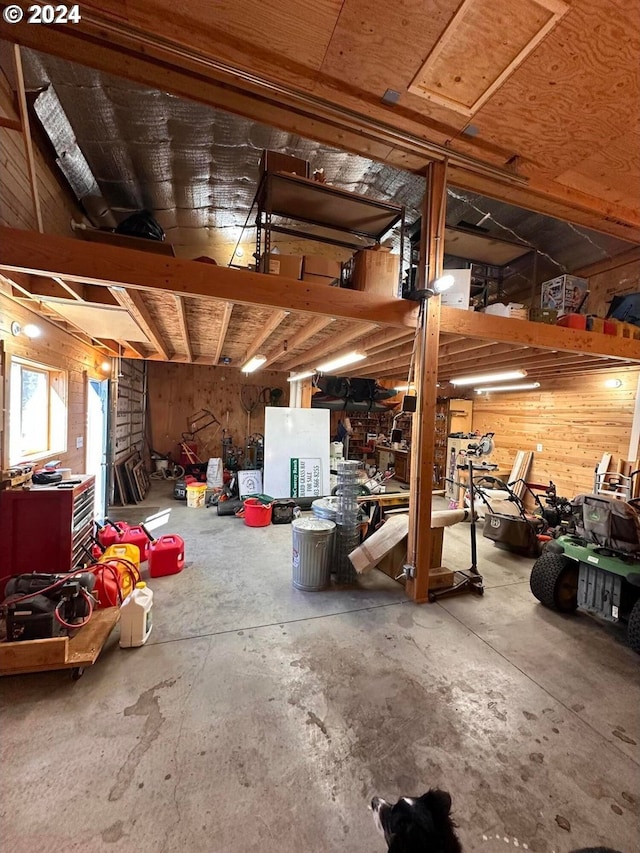 garage featuring wooden walls