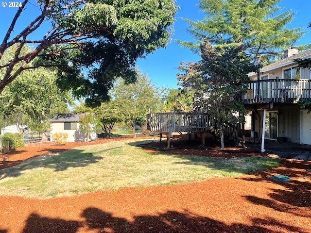 view of yard with a wooden deck