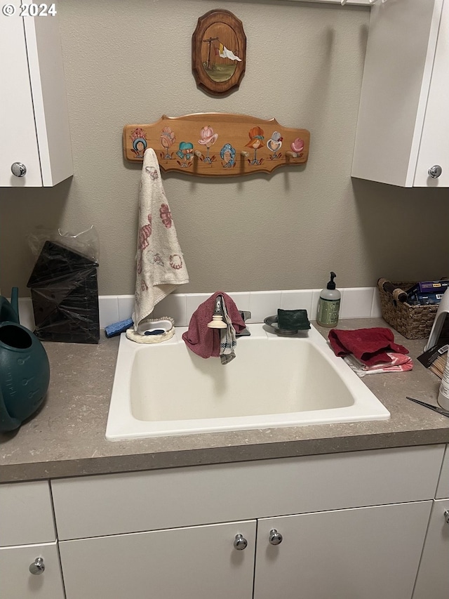 kitchen with sink and white cabinets