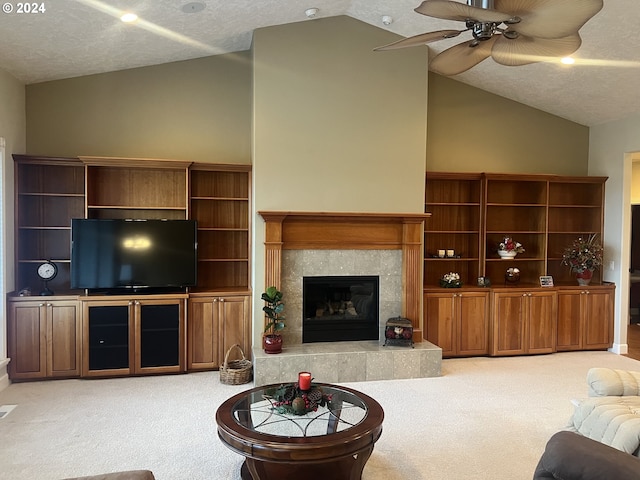 living room with a fireplace, a textured ceiling, carpet floors, and lofted ceiling