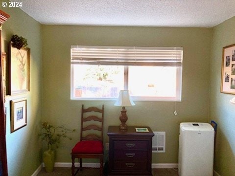 14655 SW 76th Ave Unit 5, Tigard, OR 97224 - living area featuring healthy amount of natural light and a textured ceiling