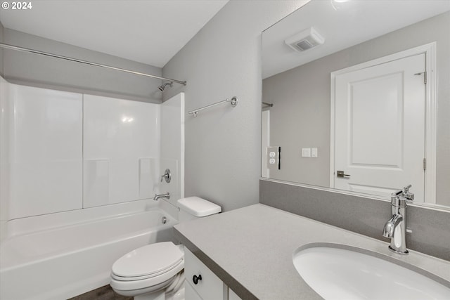 full bathroom featuring shower / bathing tub combination, vanity, and toilet