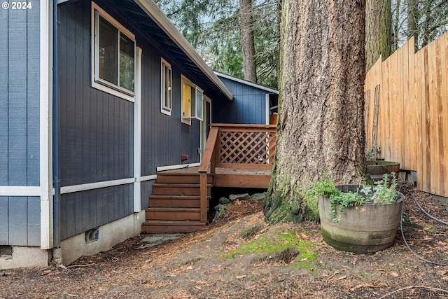 view of home's exterior featuring a wooden deck