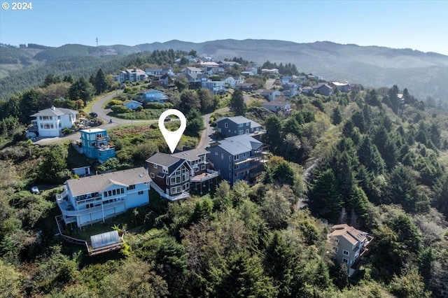 birds eye view of property with a mountain view