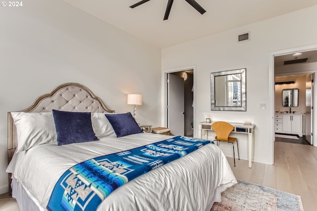 bedroom with connected bathroom, ceiling fan, sink, and light wood-type flooring