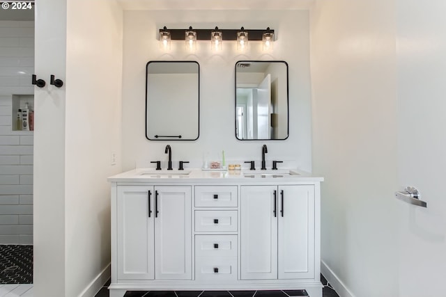 bathroom featuring tile patterned floors, vanity, and a shower