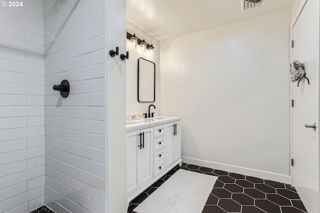 bathroom with tile patterned flooring and vanity