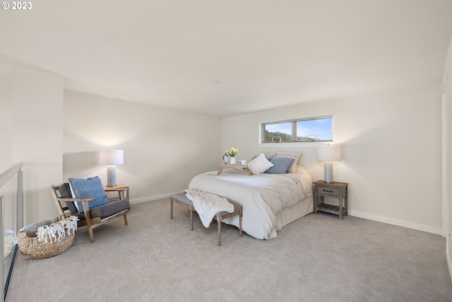 bedroom featuring light colored carpet