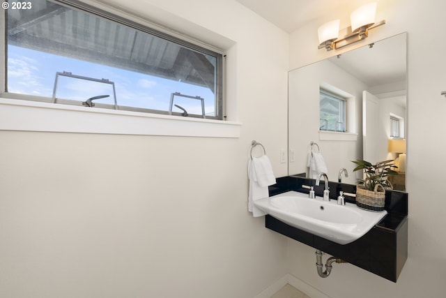 bathroom with sink and a wealth of natural light