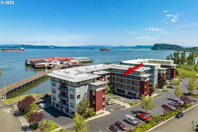 birds eye view of property with a water view