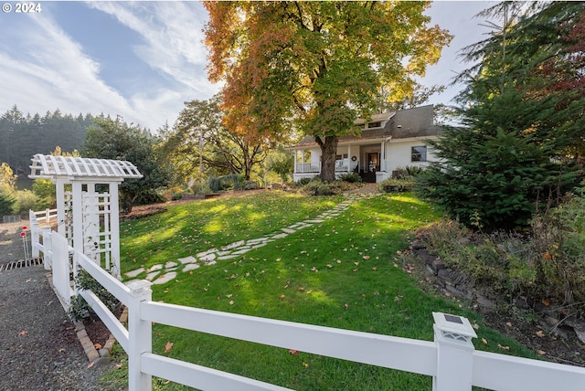 view of yard featuring covered porch