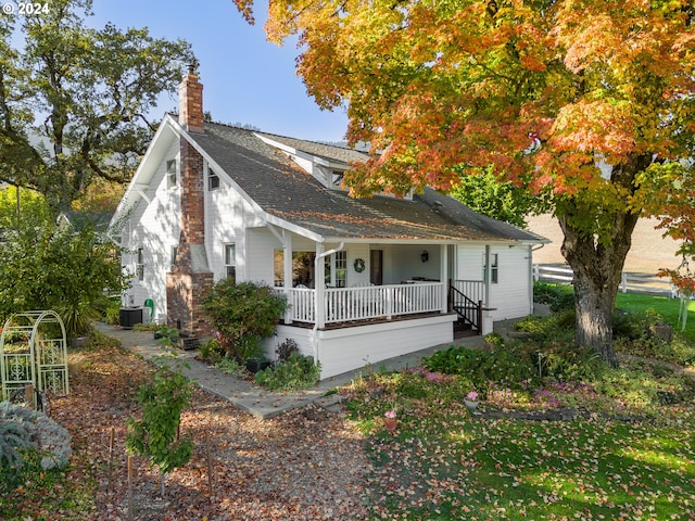 view of front of home featuring covered porch and central AC unit