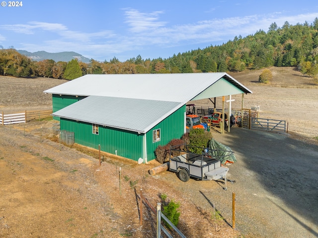 exterior space featuring an outdoor structure and a mountain view