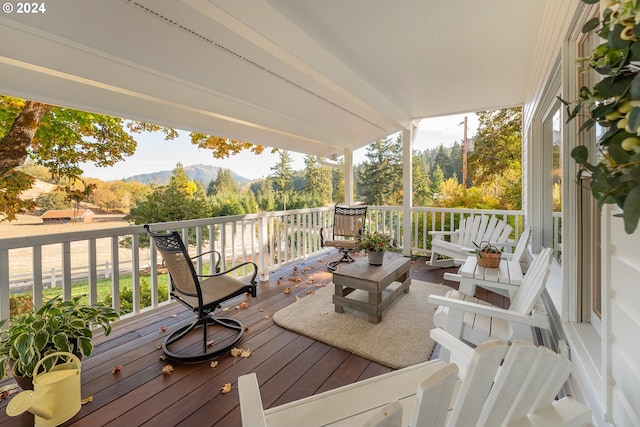 wooden deck featuring a mountain view