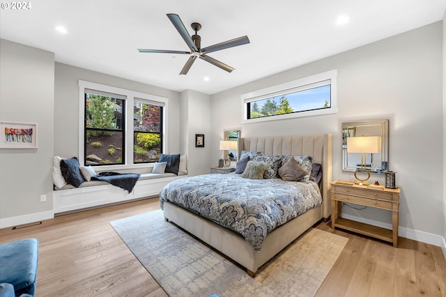 bedroom featuring ceiling fan and light wood-type flooring