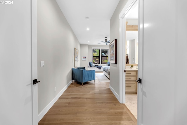 hallway with light wood-type flooring