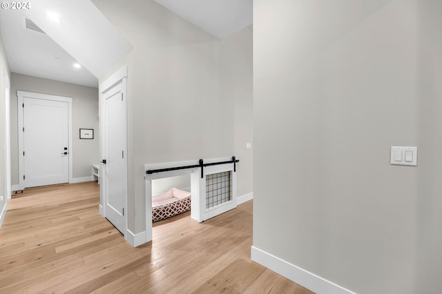 hall with light hardwood / wood-style floors