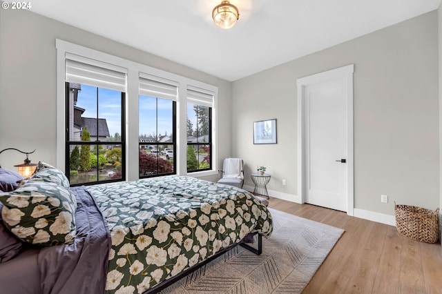 bedroom with light hardwood / wood-style floors