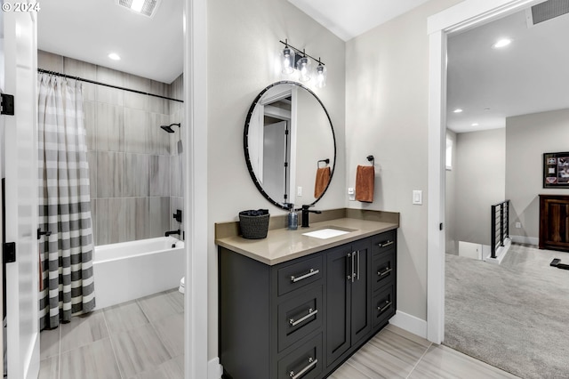 full bathroom with vanity, shower / bathtub combination with curtain, and toilet