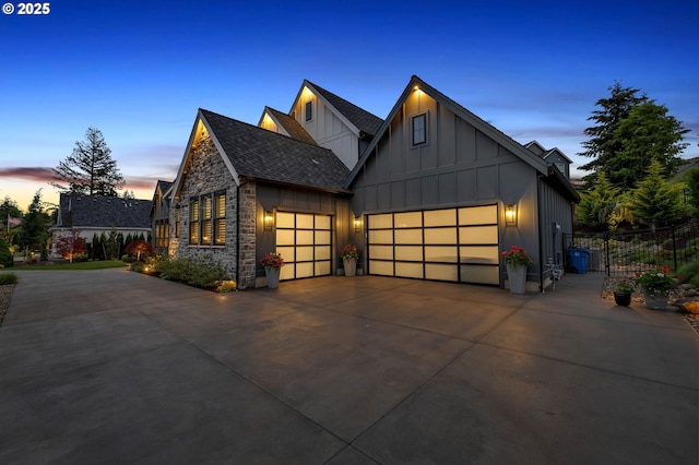 modern inspired farmhouse with a garage