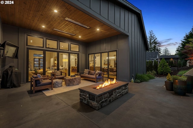 exterior space with an outdoor living space with a fire pit