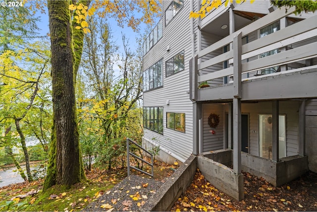 view of side of property with a balcony