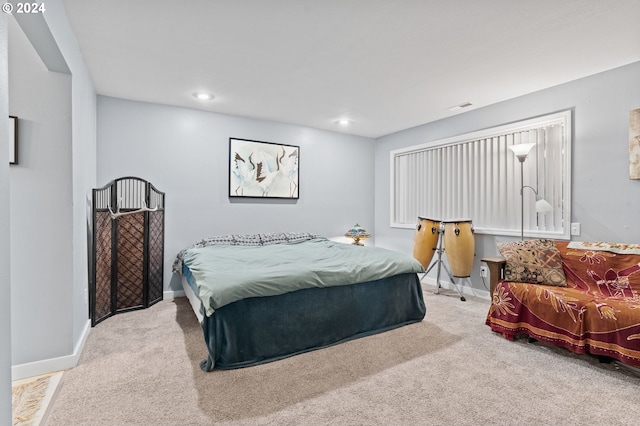 bedroom with light carpet