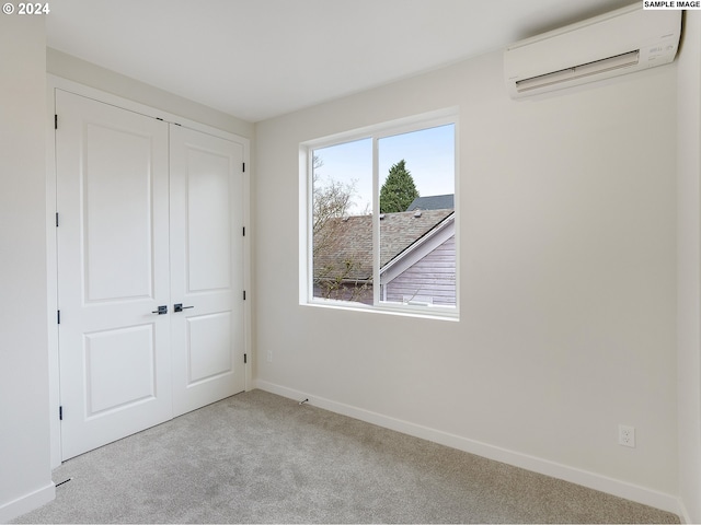 unfurnished bedroom with light carpet, a closet, and an AC wall unit