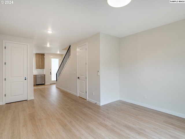 unfurnished room featuring light wood-type flooring