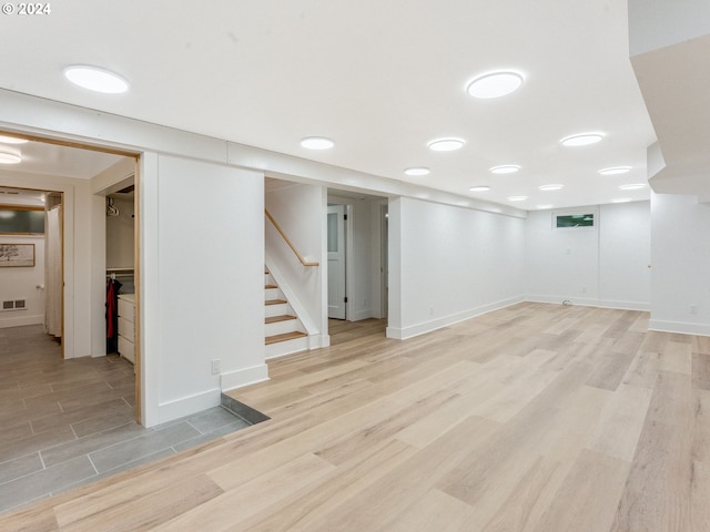 basement featuring light hardwood / wood-style flooring