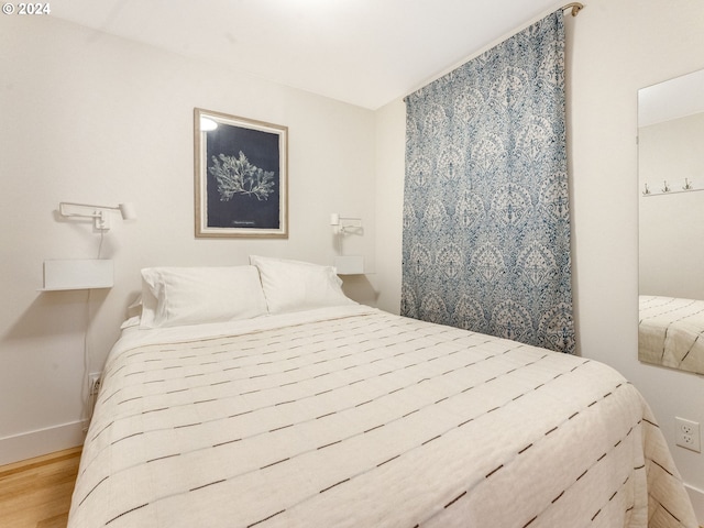 bedroom with light wood-type flooring