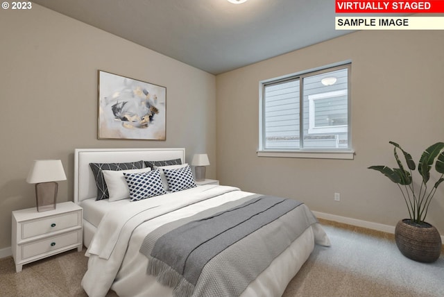 bedroom featuring light carpet