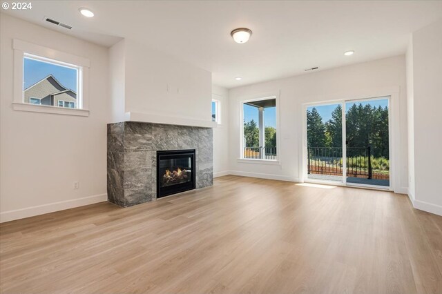 unfurnished living room featuring light hardwood / wood-style flooring