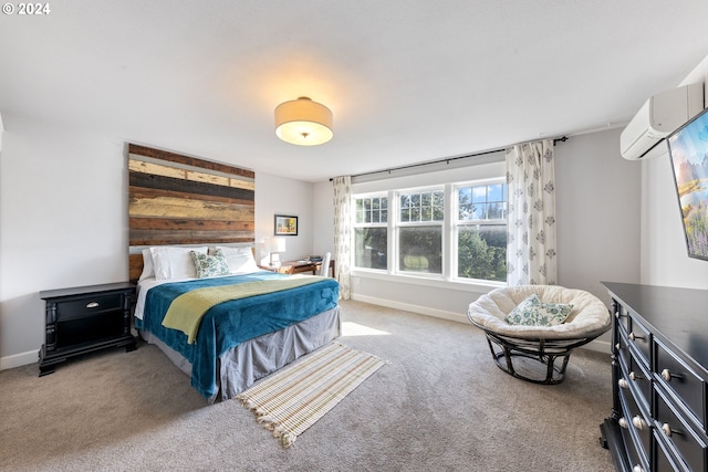 bedroom featuring a wall mounted air conditioner and carpet floors