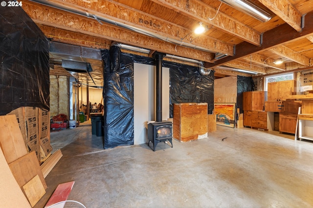 basement featuring a wood stove