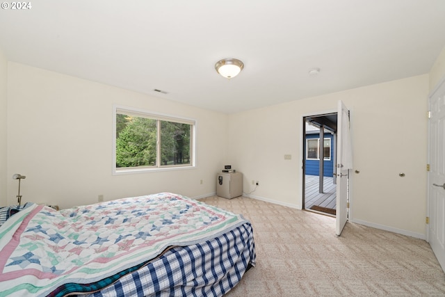 bedroom with light colored carpet