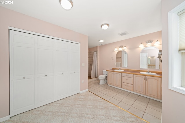 bathroom with vanity, tile patterned floors, toilet, and a shower with shower curtain