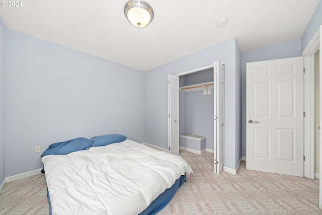 carpeted bedroom featuring a closet