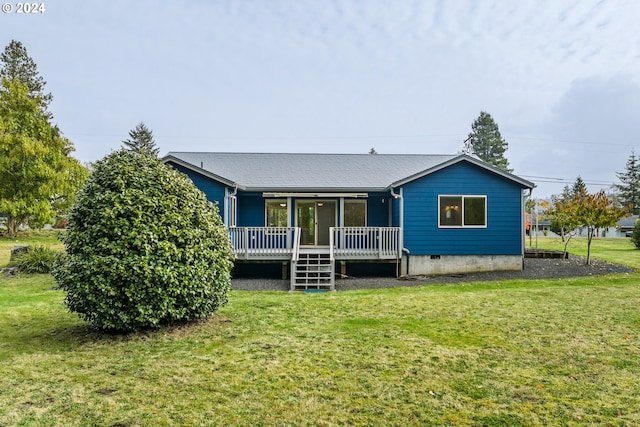 view of front of house with a front lawn and a wooden deck