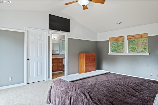 carpeted bedroom featuring connected bathroom, ceiling fan, and vaulted ceiling