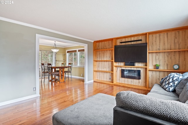 living room featuring crown molding and wood-type flooring