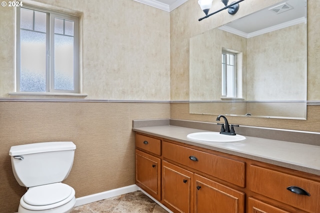 bathroom featuring vanity, toilet, and ornamental molding