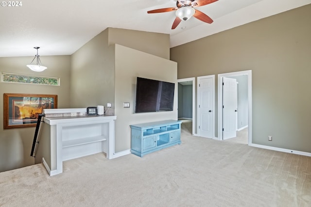 living room with ceiling fan, lofted ceiling, and light colored carpet