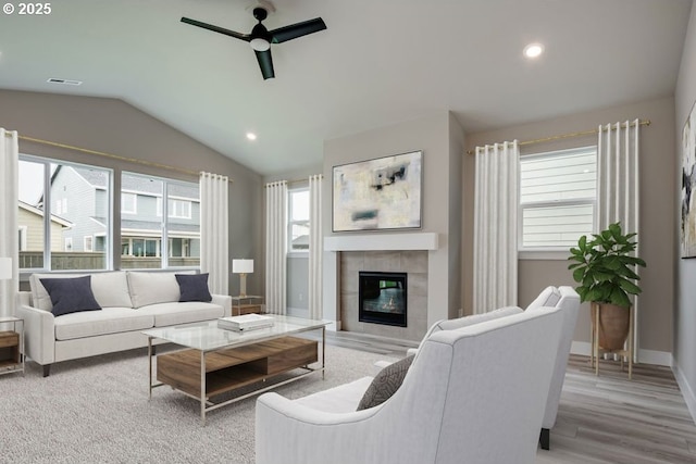 3818 S 44th Ln, Ridgefield, WA 98642 - living area with a ceiling fan, lofted ceiling, a tiled fireplace, recessed lighting, and wood finished floors