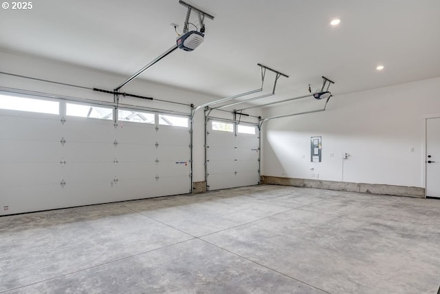 3818 S 44th Ln, Ridgefield, WA 98642 - garage with a garage door opener, electric panel, and recessed lighting